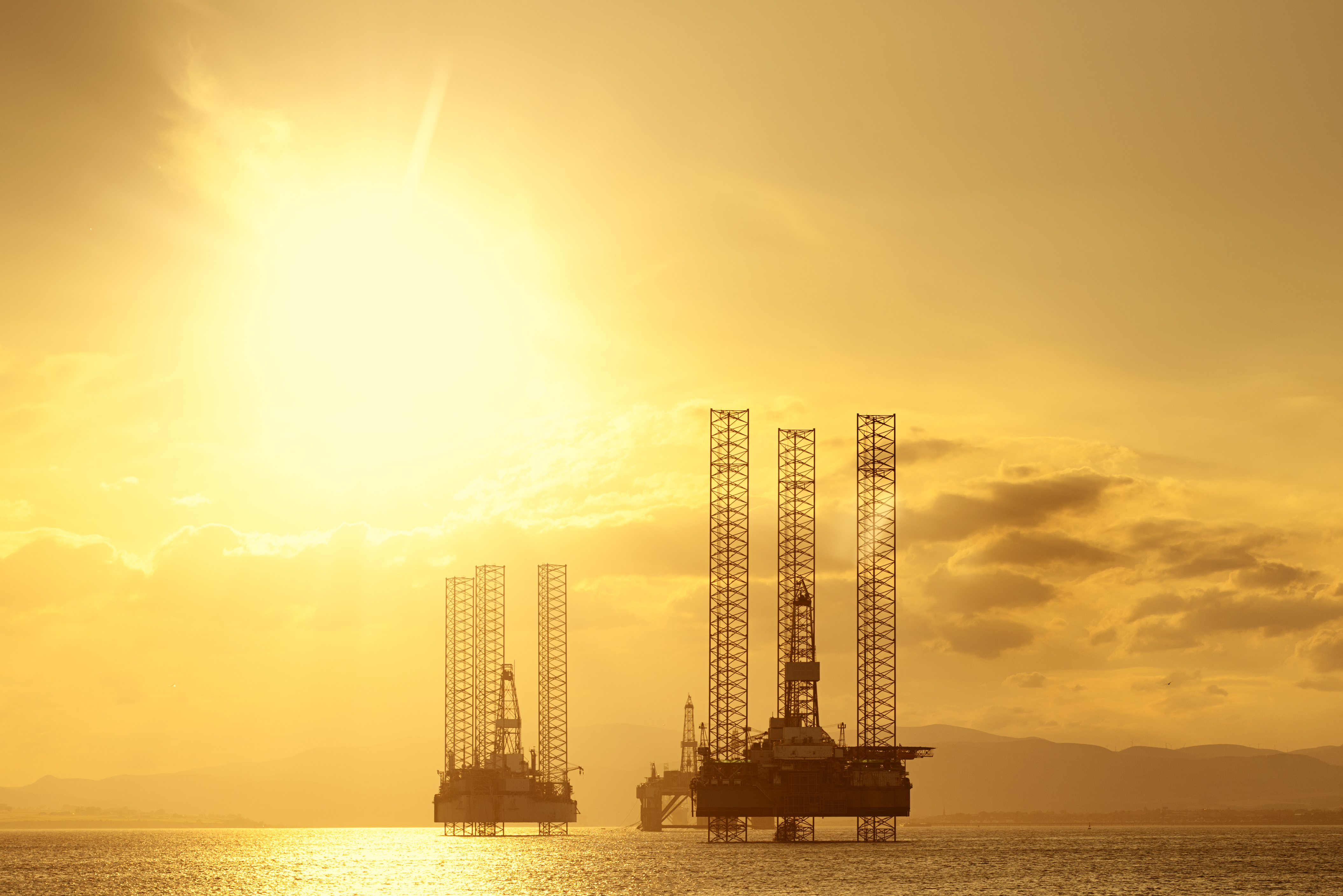 North Sea Oil Platforms At Sunset Cromarty Firth Scotland Rodanco