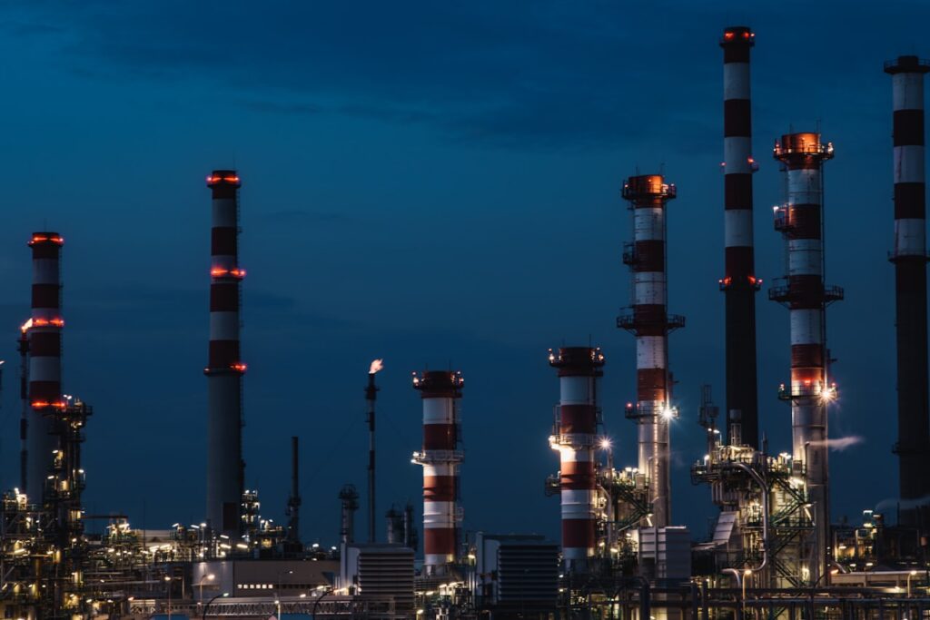 Refinery tower and flare stack in an oil processing facility where emulsion breaking and oil-water separation take place