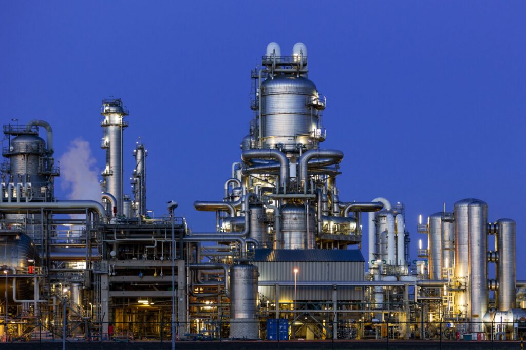 Refinery at twilight illustrating slop oil meaning and reprocessing routes