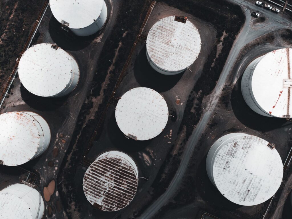 Aerial view of storage tanks illustrating slop oil tank interface control