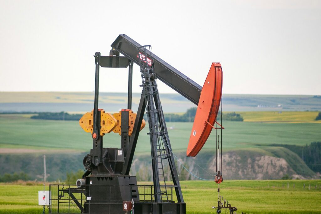 Oil pump jack in a field, a producing well where scale inhibitors are applied