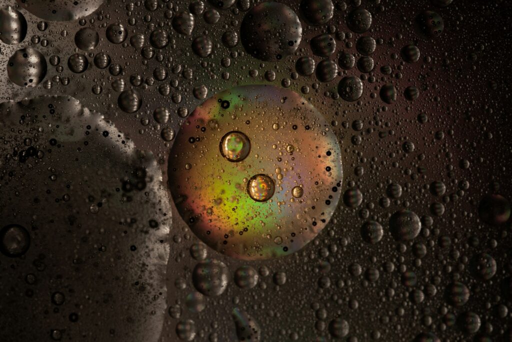 Macro photo of a large droplet holding smaller droplets, like a multiple emulsion