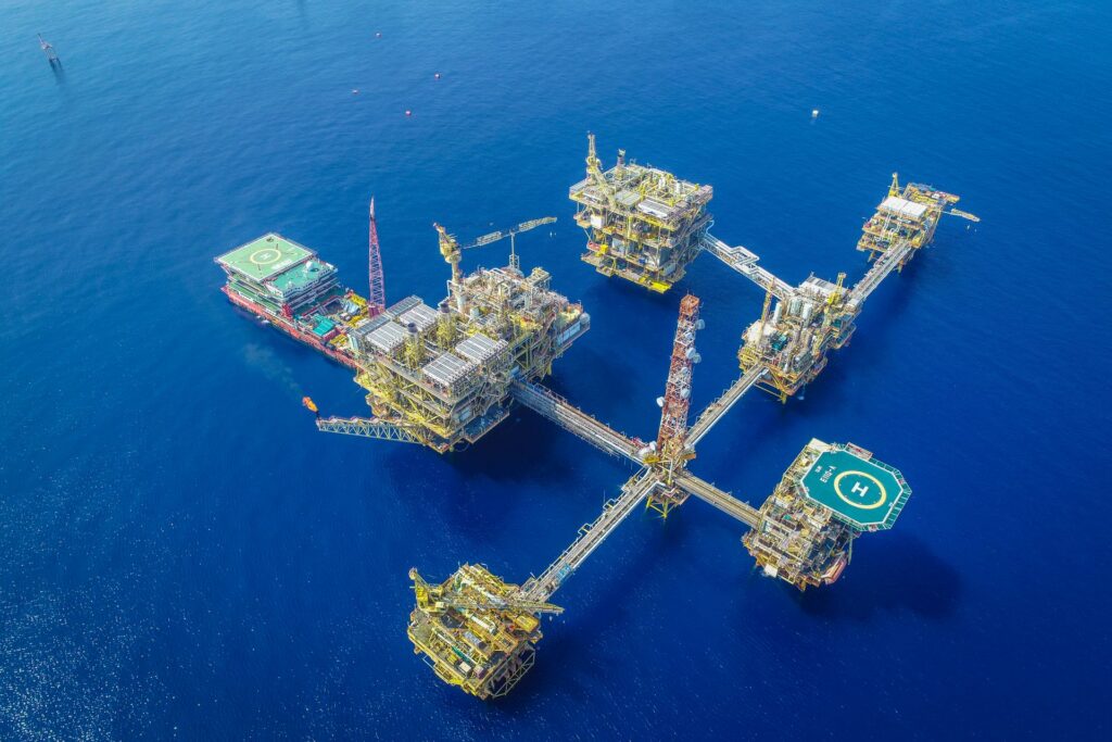 Aerial view of a large offshore oil and gas production platform complex